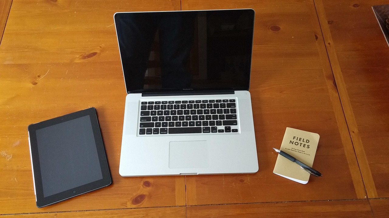 Author working on a laptop at a writing desk