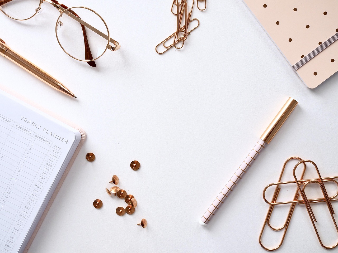 Notebook and planning materials arranged on a desk